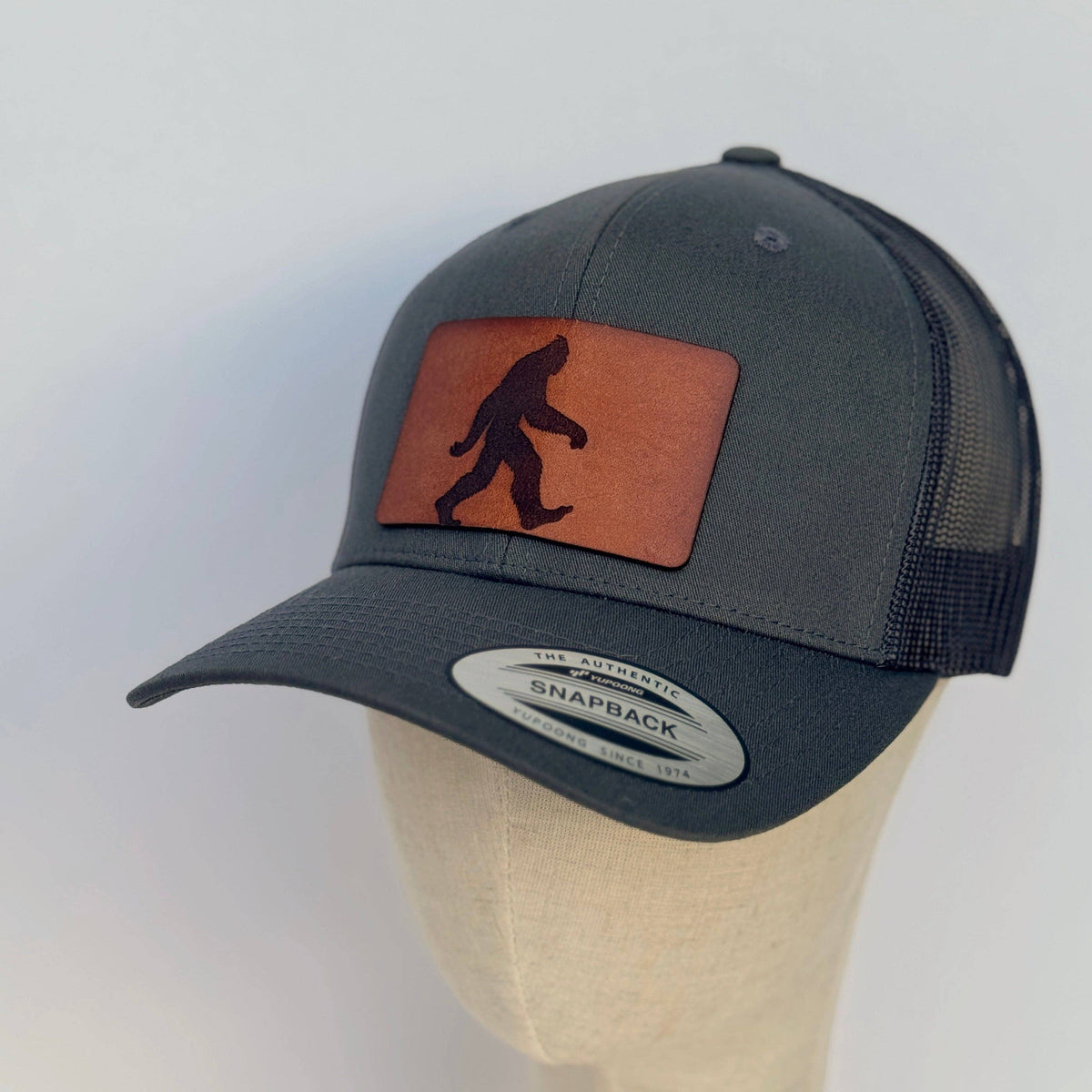 Sasquatch | bigfoot leather patch hat Charcoal Curved Trucker